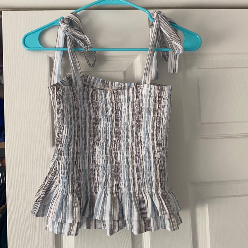 Tank from a local boutique. Size L, fits size M